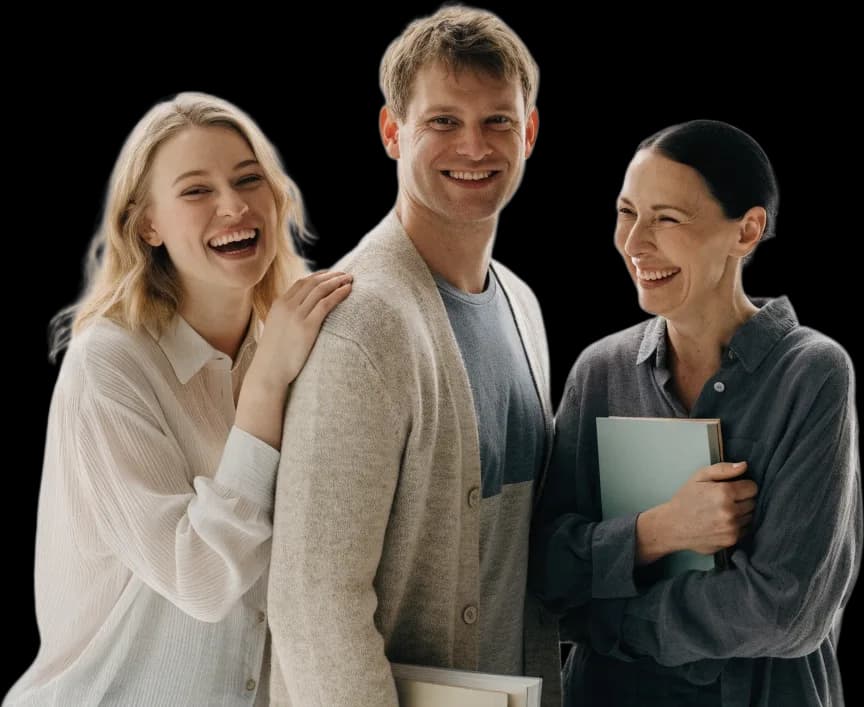 Three Lingva Pro teachers laughing, two of them holding books